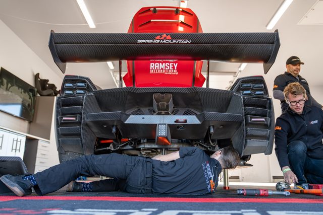 Crew working on the #592 in the garage